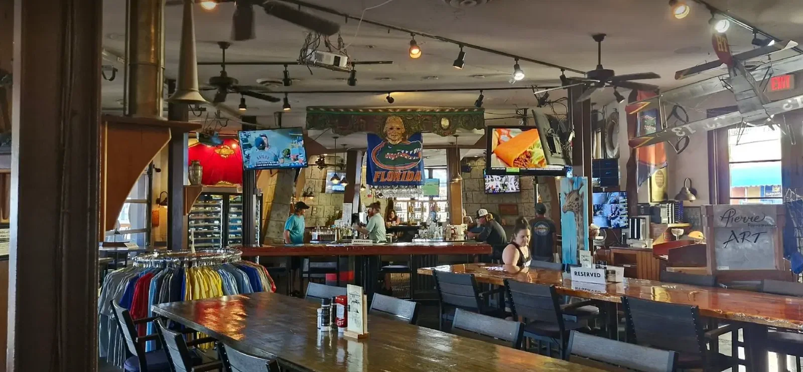 Florida Gators banner hanging above the bar and TVs in the dining room at Harry T's Lighthouse in Destin